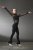 Figure skater in black supplex training one piece with black mesh and long sleeves